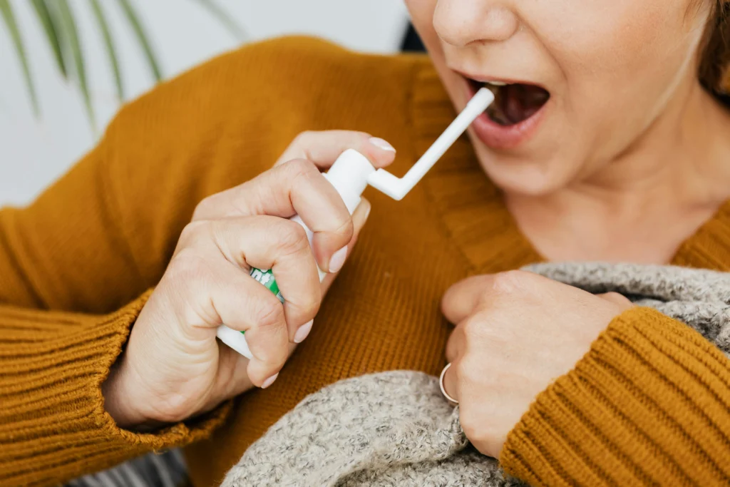 woman with mouth spray