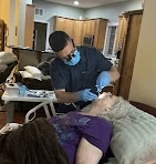 woman receiving at home dental care