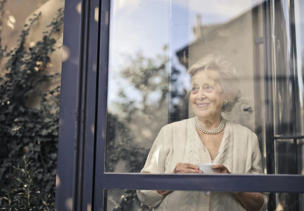 woman looking out a window 
